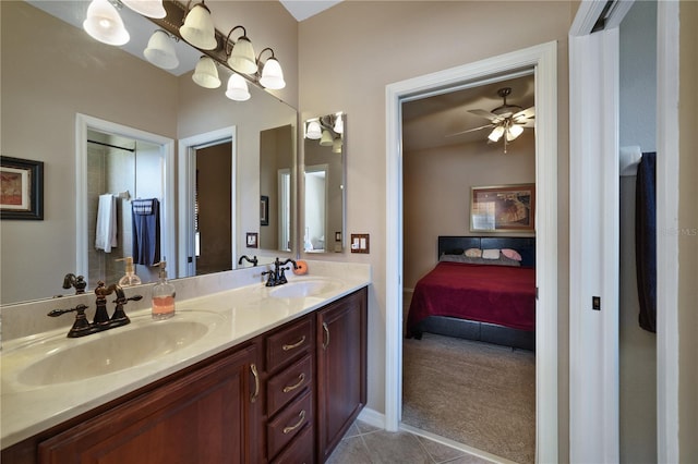 bathroom with ceiling fan, tile patterned flooring, and vanity