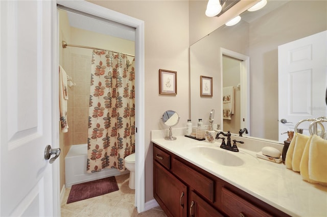 full bathroom featuring tile patterned floors, shower / tub combo with curtain, vanity, and toilet