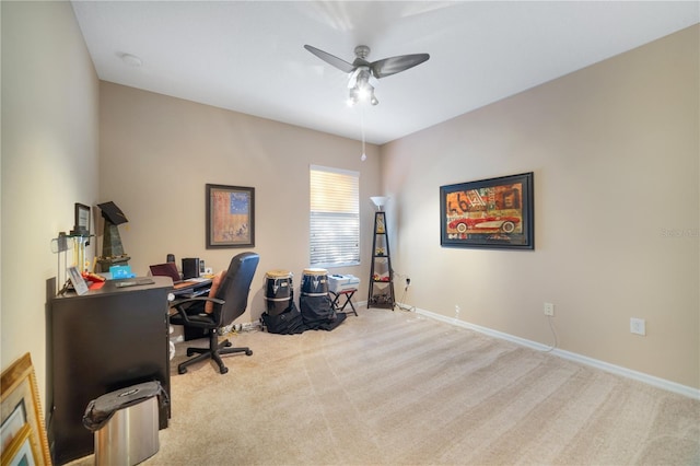 home office featuring ceiling fan and light carpet