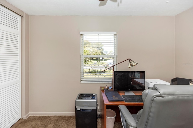 office area featuring ceiling fan and dark colored carpet