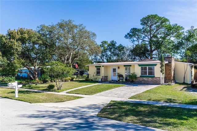 ranch-style house with a front yard