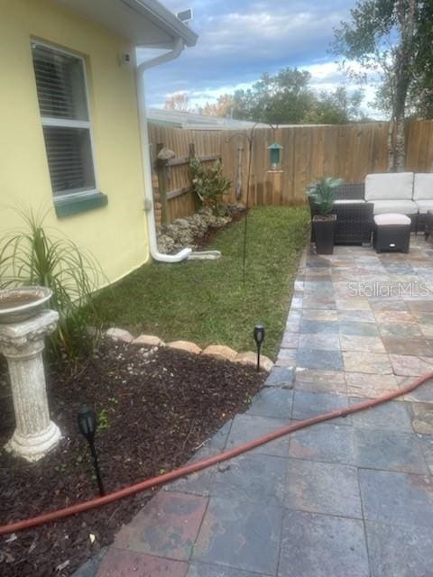 view of yard with an outdoor hangout area and a patio