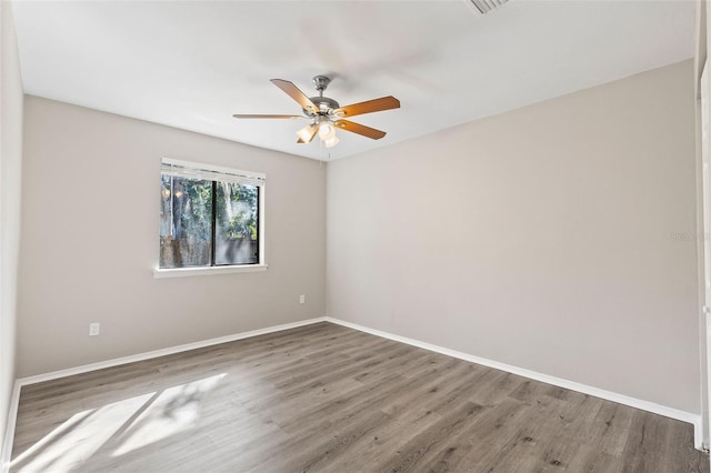 unfurnished room featuring ceiling fan and wood-type flooring