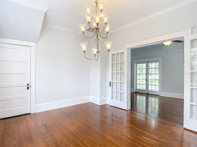 unfurnished dining area with dark hardwood / wood-style floors, an inviting chandelier, ornamental molding, and french doors