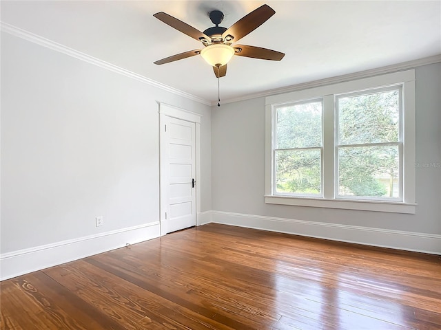 empty room with hardwood / wood-style flooring, ceiling fan, and crown molding