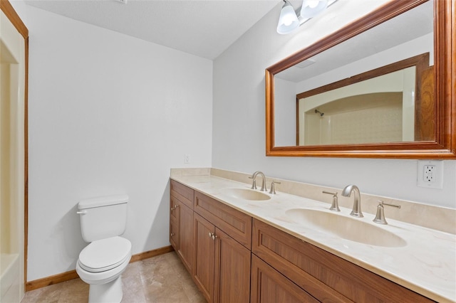 bathroom with a shower, vanity, and toilet