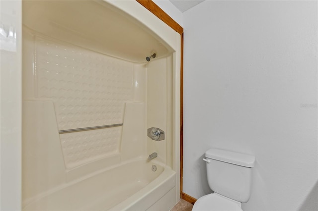 bathroom featuring bathing tub / shower combination and toilet