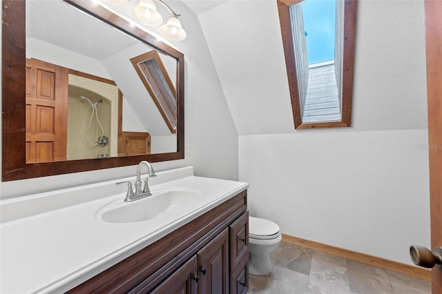 bathroom with walk in shower, vanity, vaulted ceiling, and toilet