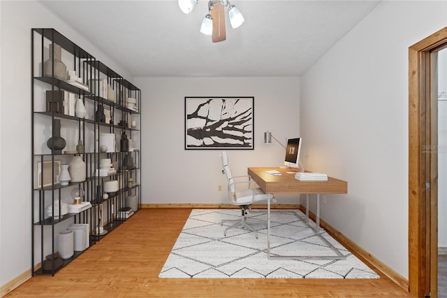 office with ceiling fan and wood-type flooring