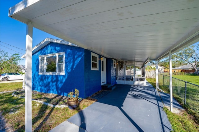 view of patio with a carport