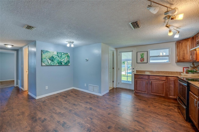 kitchen featuring a textured ceiling, rail lighting, black electric range oven, and dark wood-type flooring