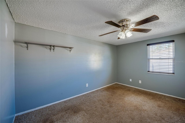 unfurnished room featuring ceiling fan, carpet floors, and a textured ceiling