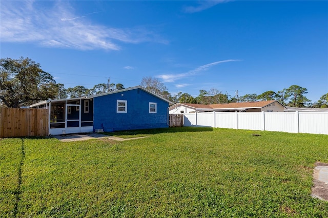 view of yard with a sunroom