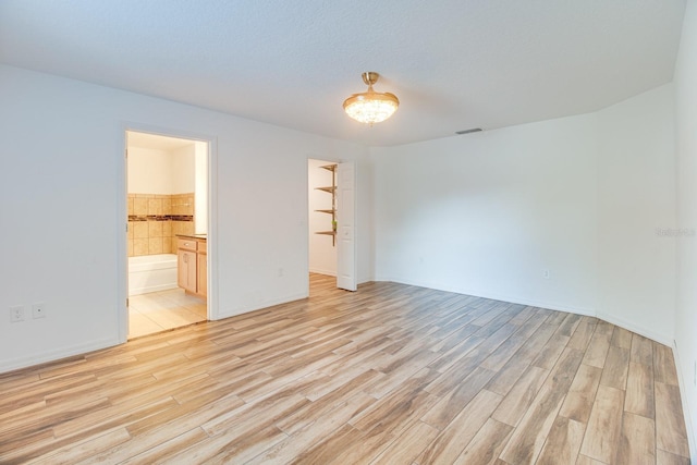 spare room with light wood-type flooring