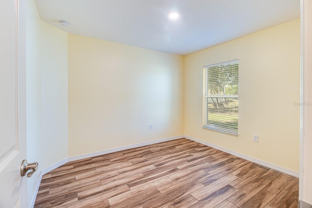 unfurnished room featuring light hardwood / wood-style floors