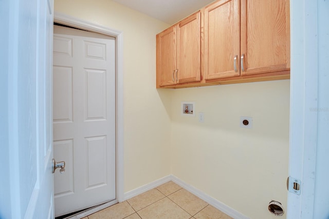 laundry area with hookup for an electric dryer, light tile patterned flooring, cabinets, and hookup for a washing machine