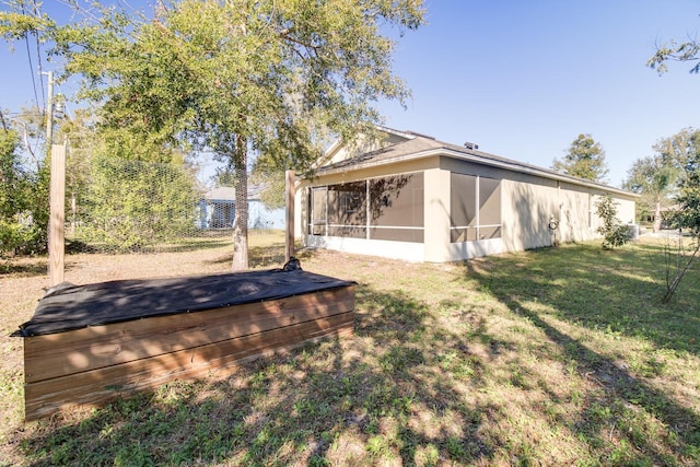 view of yard featuring a sunroom