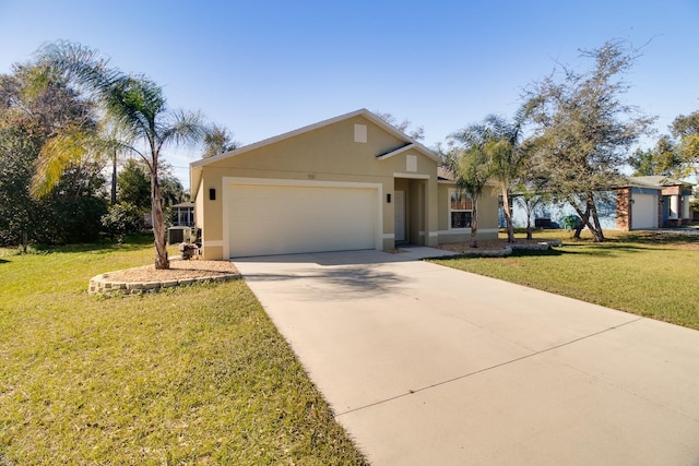 view of front of house featuring a garage and a front lawn