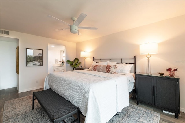 bedroom with ceiling fan, ensuite bathroom, and hardwood / wood-style flooring