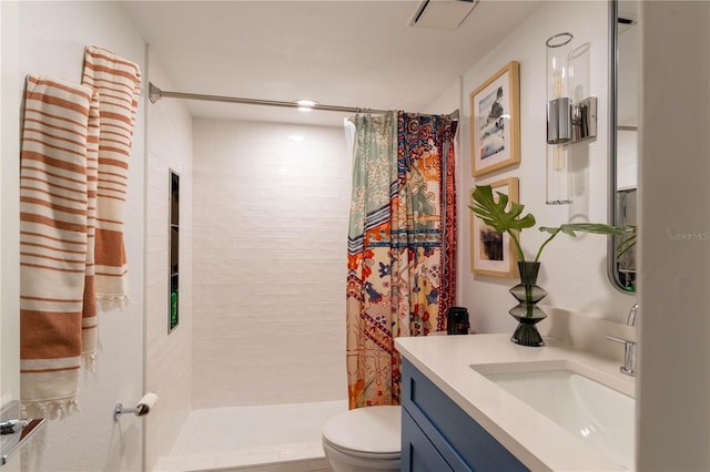 bathroom featuring vanity, toilet, and walk in shower