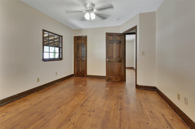 unfurnished bedroom featuring light hardwood / wood-style flooring and ceiling fan