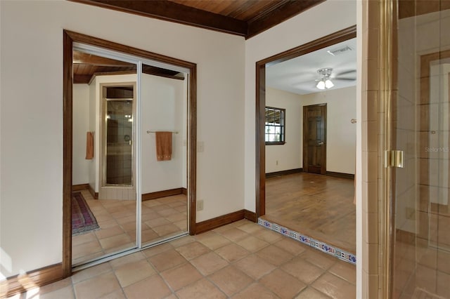 interior space featuring light tile patterned flooring and wooden ceiling