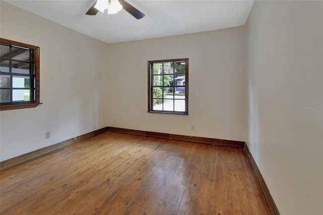 unfurnished room featuring ceiling fan and wood-type flooring