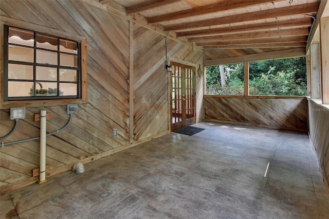 interior space featuring vaulted ceiling with beams, wood ceiling, and french doors