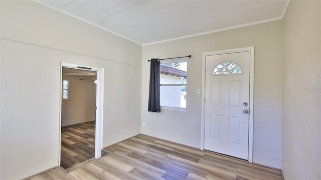 entryway featuring crown molding and light hardwood / wood-style flooring