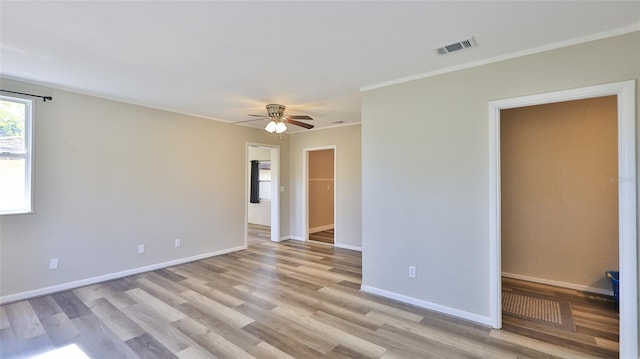 unfurnished room featuring ceiling fan and light wood-type flooring