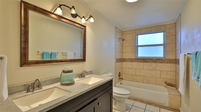 full bathroom with tile patterned flooring, vanity, tiled shower / bath combo, and toilet