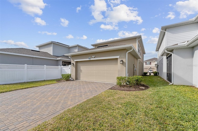 view of side of property with a garage and a lawn