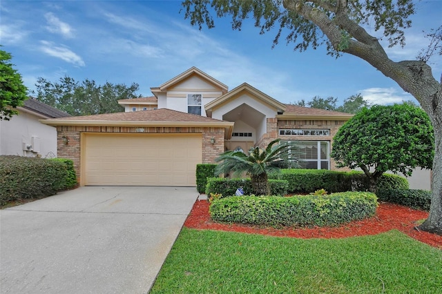 view of front of house featuring a front yard and a garage