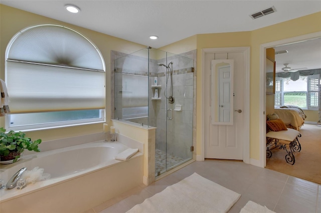 bathroom with tile patterned floors and independent shower and bath