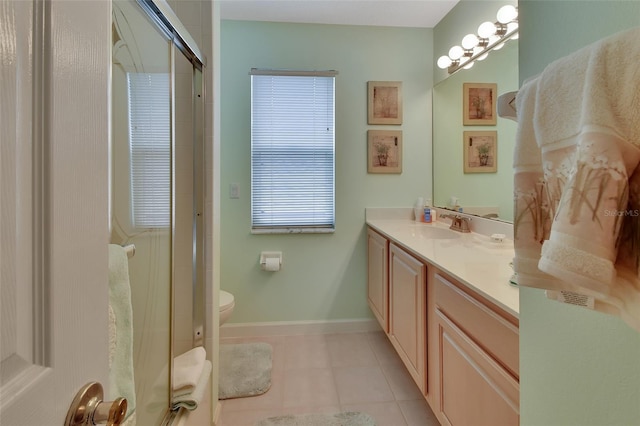 bathroom with vanity, tile patterned flooring, toilet, a wealth of natural light, and an enclosed shower