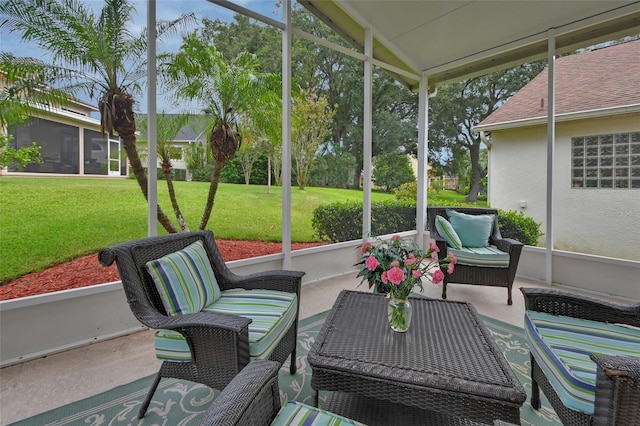 sunroom / solarium featuring vaulted ceiling