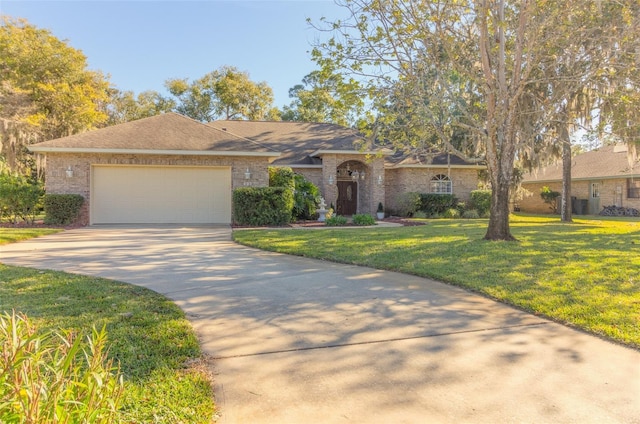 single story home featuring a front yard and a garage