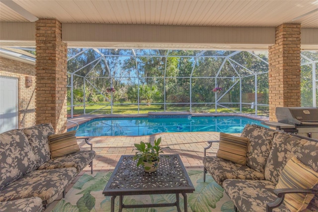 view of pool with a patio area, glass enclosure, and outdoor lounge area