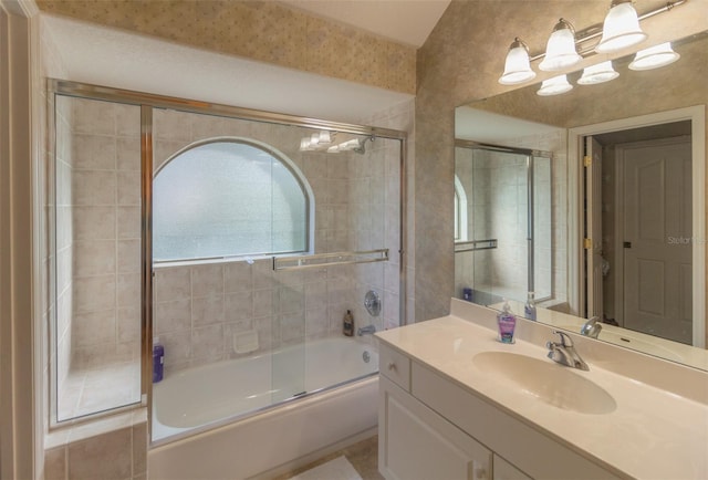 bathroom with shower / bath combination with glass door and vanity