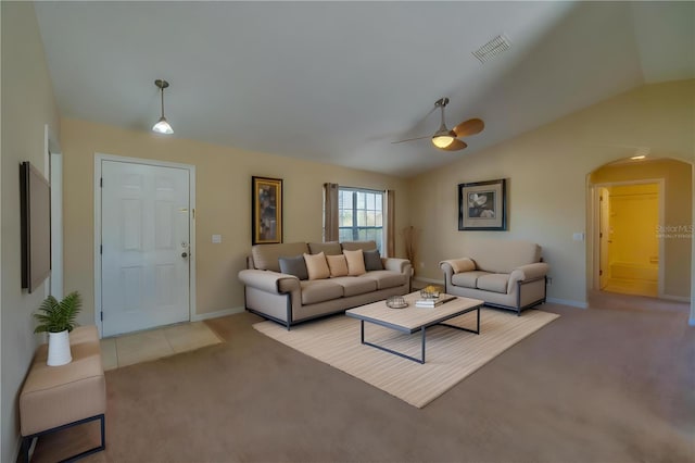 living room featuring light carpet, vaulted ceiling, and ceiling fan