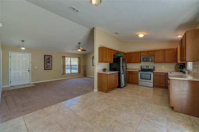 kitchen with ceiling fan, light tile patterned floors, sink, and appliances with stainless steel finishes