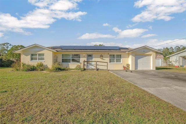 ranch-style home with a front yard and a garage