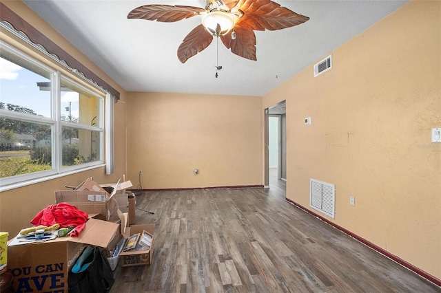 unfurnished room with ceiling fan and hardwood / wood-style flooring