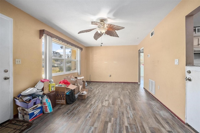 empty room with hardwood / wood-style flooring and ceiling fan