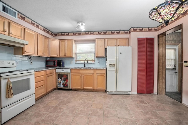 kitchen with light stone countertops, sink, backsplash, a textured ceiling, and white appliances