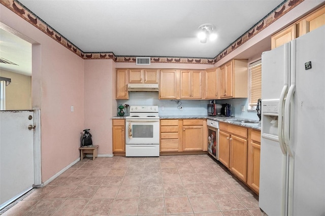 kitchen with white appliances, sink, light stone countertops, light tile patterned floors, and tasteful backsplash