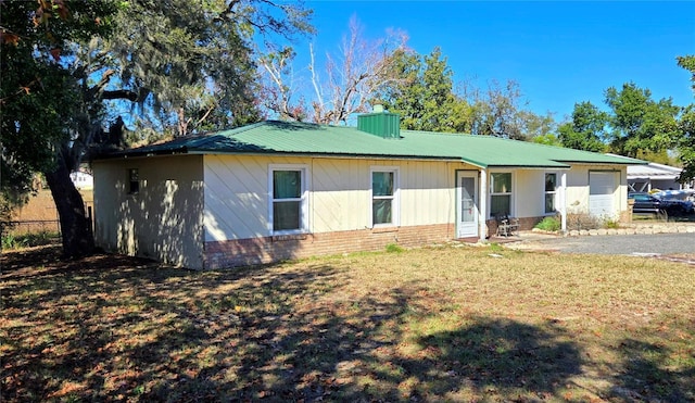 exterior space featuring a front lawn