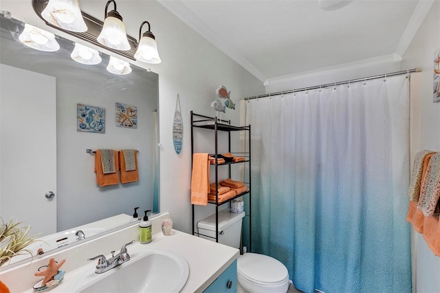 bathroom with crown molding, vanity, and toilet