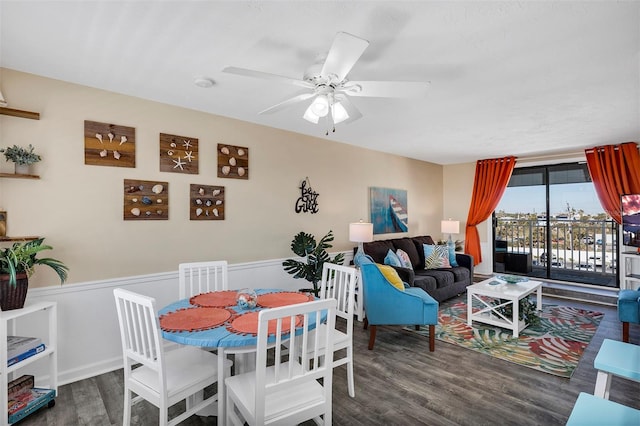 dining area featuring ceiling fan and dark hardwood / wood-style floors