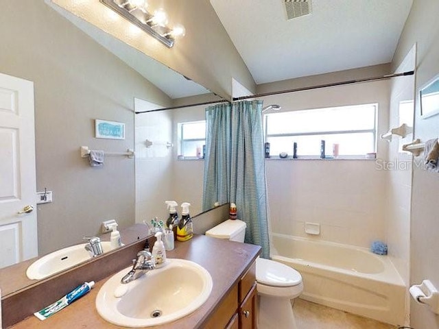 full bathroom featuring tile patterned flooring, lofted ceiling, toilet, vanity, and shower / tub combo